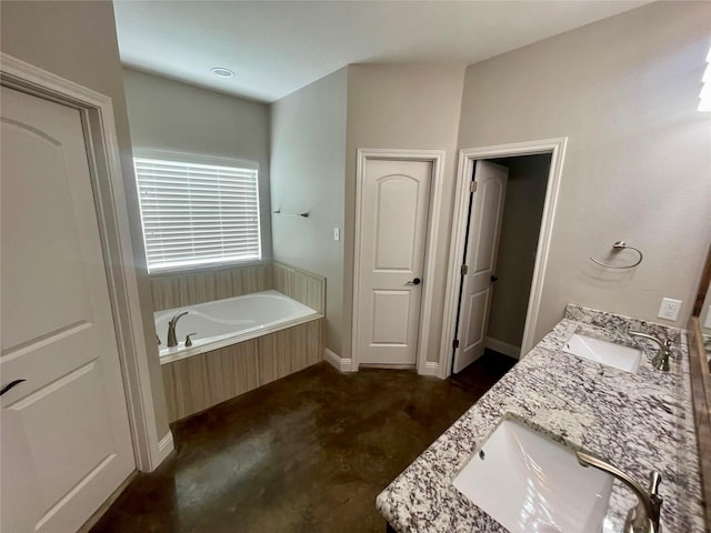 bathroom with vanity and a bathtub