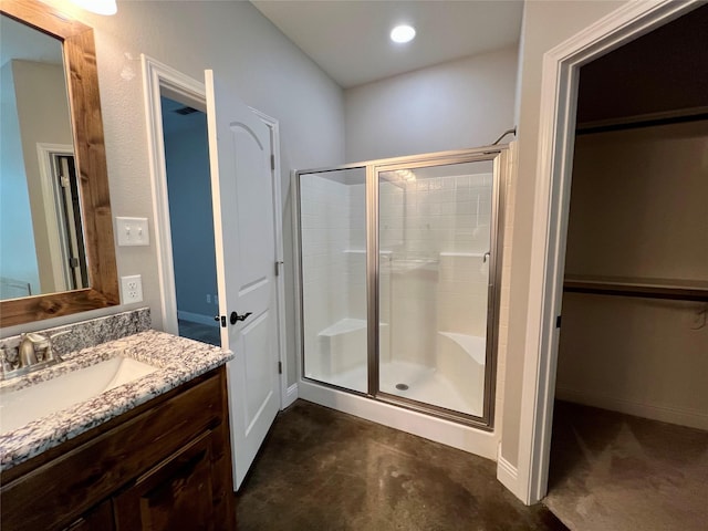 bathroom with vanity and walk in shower