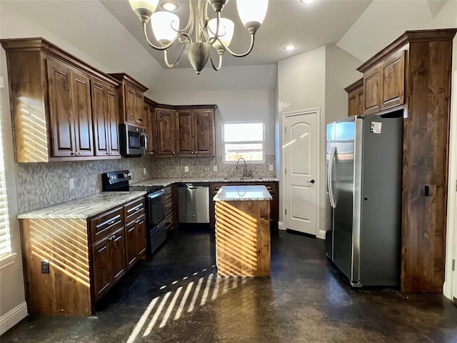 kitchen with sink, light stone counters, tasteful backsplash, a center island, and stainless steel appliances