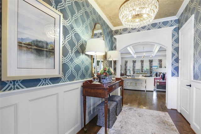 foyer entrance with a notable chandelier, coffered ceiling, beam ceiling, and dark hardwood / wood-style floors