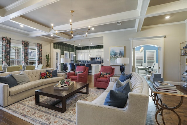 living room with hardwood / wood-style flooring, a chandelier, and crown molding