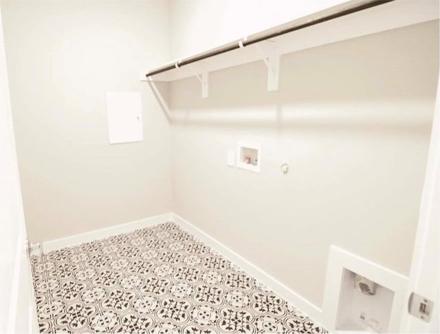 washroom featuring washer hookup, hookup for a gas dryer, and light tile patterned flooring