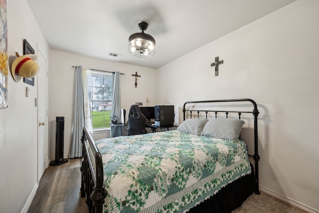 bedroom featuring hardwood / wood-style floors