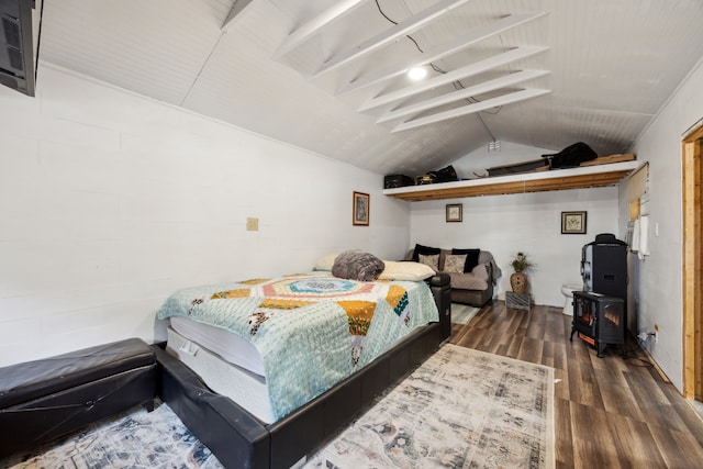 bedroom featuring dark hardwood / wood-style flooring and lofted ceiling