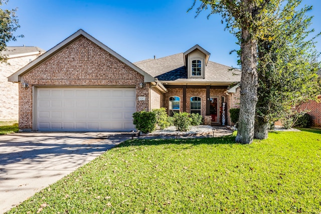 view of front of home with a garage and a front yard