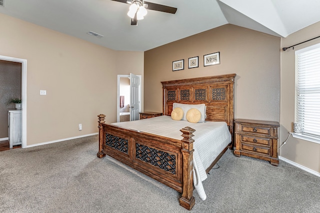 carpeted bedroom with ceiling fan and vaulted ceiling