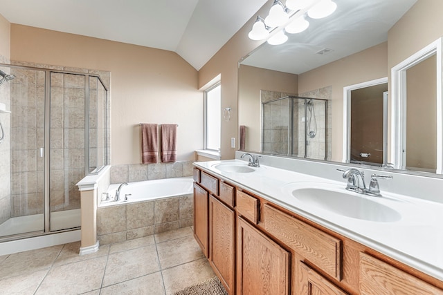 bathroom with tile patterned flooring, vanity, a notable chandelier, and plus walk in shower