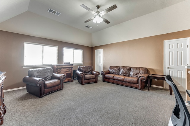 carpeted living room featuring ceiling fan and lofted ceiling