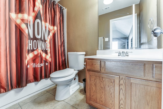 full bathroom featuring vanity, toilet, shower / bath combo with shower curtain, and tile patterned flooring