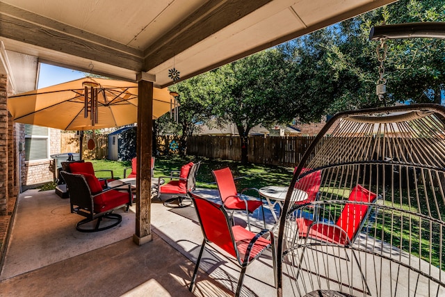 view of patio with a storage shed