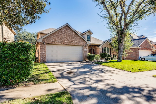 front facade with a garage and a front lawn