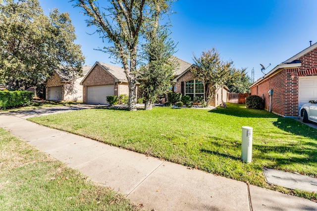 view of front of property featuring a garage and a front yard