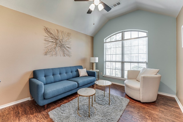 living room with ceiling fan, dark wood-type flooring, lofted ceiling, and a healthy amount of sunlight