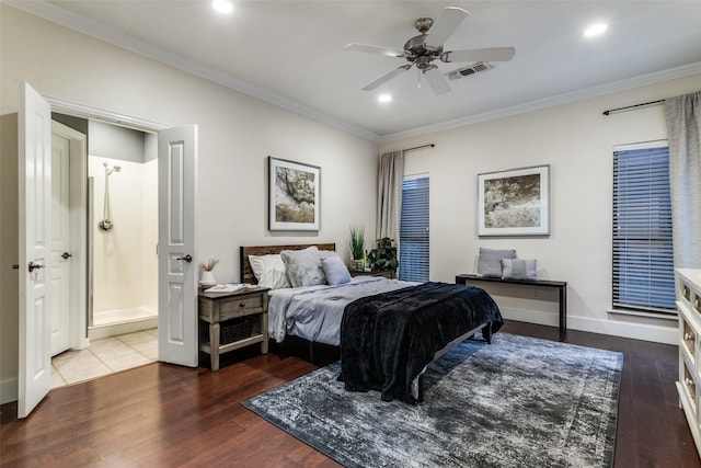 bedroom featuring ceiling fan, connected bathroom, crown molding, and dark hardwood / wood-style floors