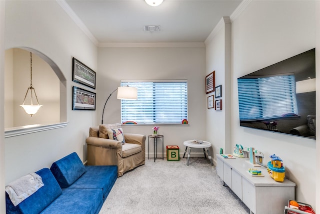 living room with carpet and crown molding