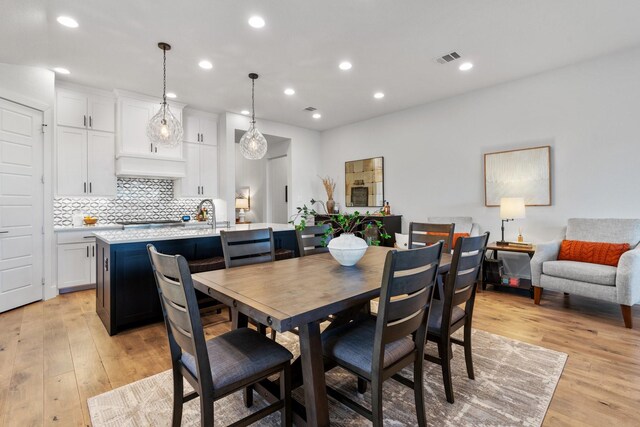 dining room with recessed lighting, visible vents, and light wood-style flooring