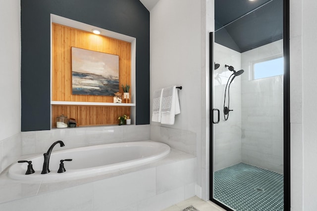 bathroom with lofted ceiling, tile patterned floors, and shower with separate bathtub