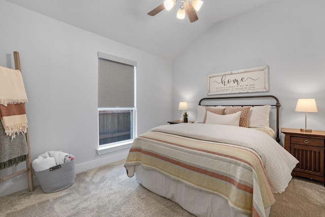 bedroom with vaulted ceiling, light carpet, and ceiling fan