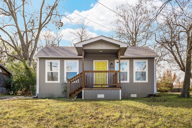 1206 W Hanna St, Denison, TX 75020 - bungalow-style home with crawl space, roof with shingles, and a front lawn