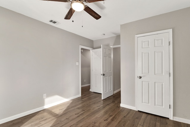 1206 W Hanna St, Denison, TX 75020 - unfurnished bedroom with wood finished floors and ceiling fan