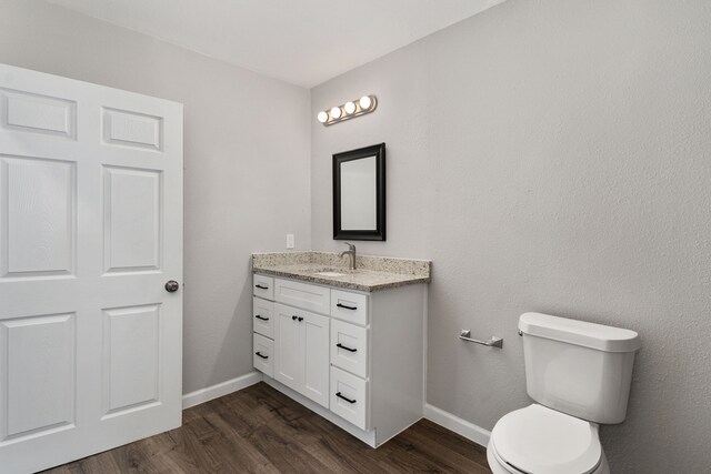 1206 W Hanna St, Denison, TX 75020 - half bath with vanity and wood finished floors