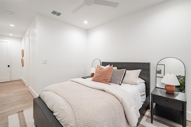 bedroom featuring light hardwood / wood-style flooring and ceiling fan