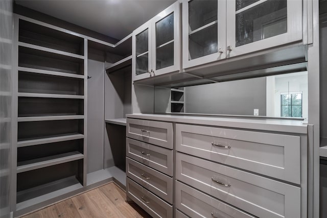 walk in closet featuring light hardwood / wood-style floors