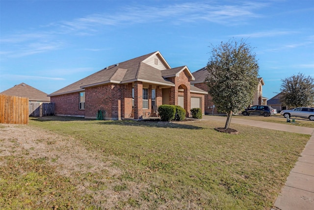 view of front of house with a garage and a front yard