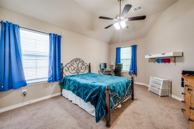 carpeted bedroom with ceiling fan and lofted ceiling