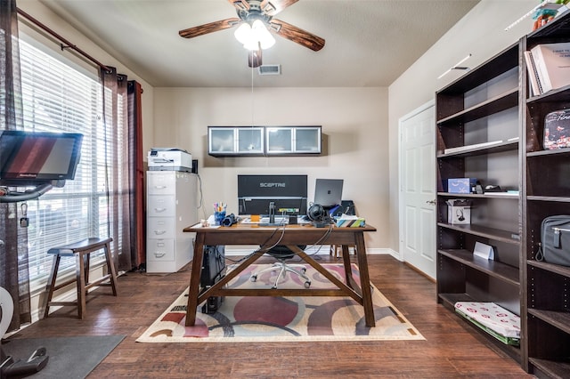 office area featuring ceiling fan and dark hardwood / wood-style flooring