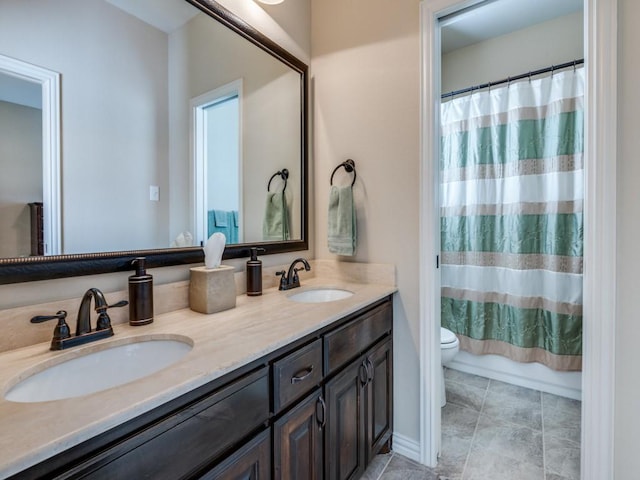 full bathroom featuring toilet, vanity, and shower / tub combo