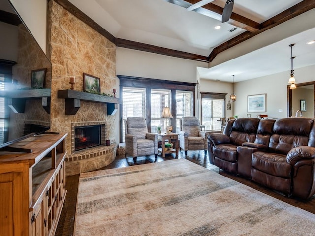 living room with beam ceiling, a fireplace, and dark hardwood / wood-style flooring