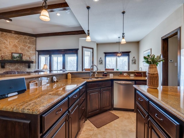 kitchen with dishwasher, decorative light fixtures, sink, light tile patterned flooring, and dark brown cabinets