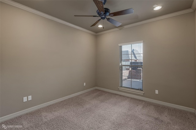 empty room with crown molding, carpet, and ceiling fan