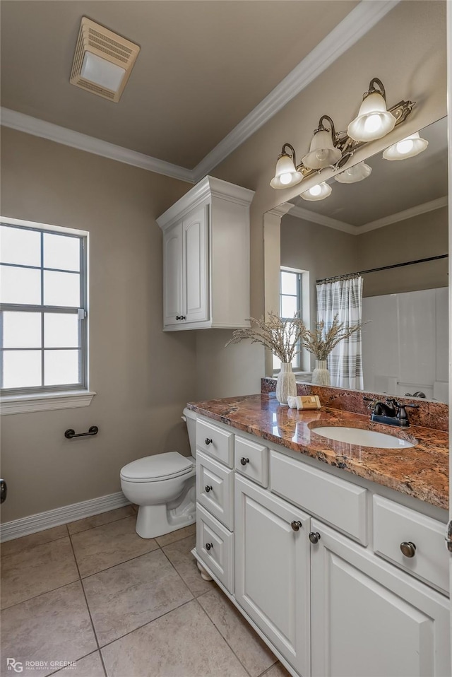 bathroom featuring crown molding, vanity, tile patterned floors, toilet, and walk in shower