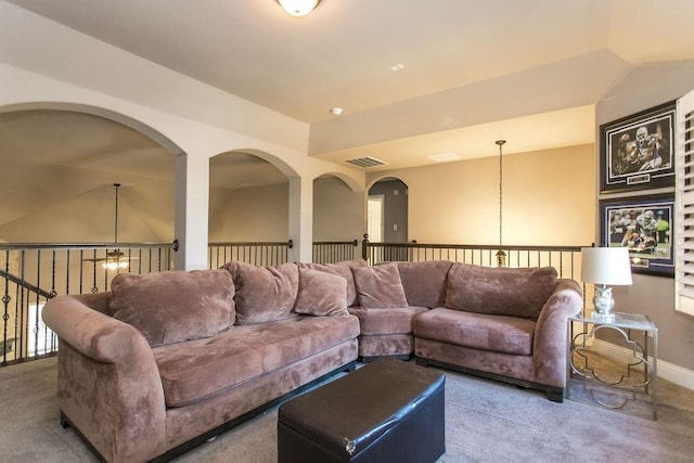 living room featuring vaulted ceiling and carpet floors