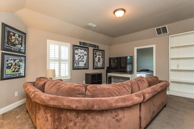 carpeted living room featuring lofted ceiling