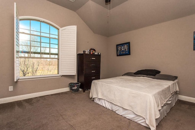 bedroom featuring multiple windows, carpet floors, and lofted ceiling