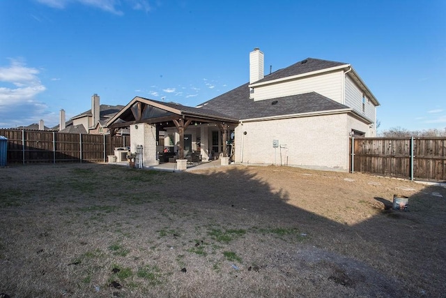 back of property featuring a patio