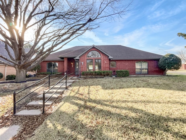 ranch-style home featuring a front yard