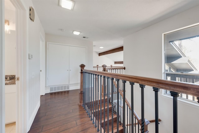 hallway featuring dark hardwood / wood-style flooring