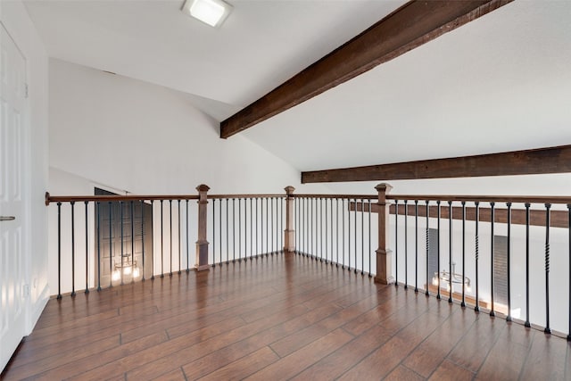 interior space featuring vaulted ceiling with beams and dark hardwood / wood-style floors