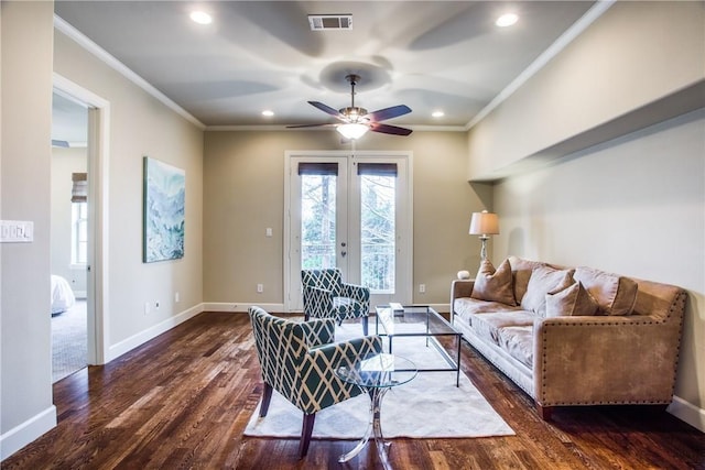 living room featuring crown molding, dark wood-type flooring, ceiling fan, and french doors