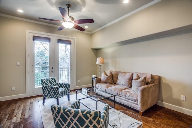 living room with ceiling fan, dark wood-type flooring, ornamental molding, and french doors