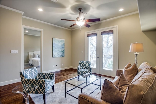 living room with ceiling fan, hardwood / wood-style floors, ornamental molding, and french doors