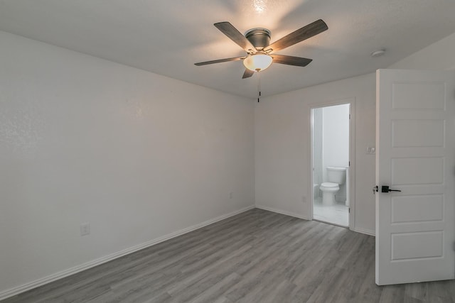 unfurnished room with ceiling fan and light hardwood / wood-style flooring