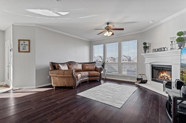 living room featuring hardwood / wood-style flooring, crown molding, and ceiling fan