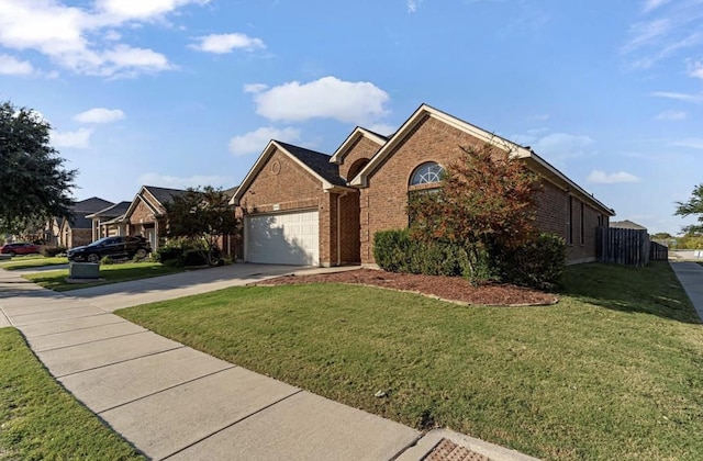 view of front property with a garage and a front yard