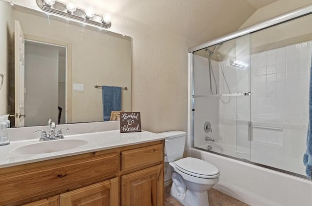 full bathroom with vanity, toilet, and enclosed tub / shower combo