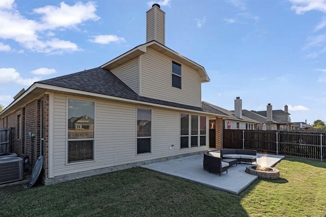 back of house with a fire pit, central AC unit, a lawn, and a patio